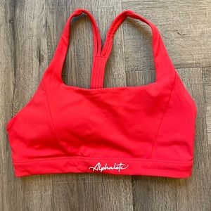 Alphalete Pulse Kinetic Bra in Coral.